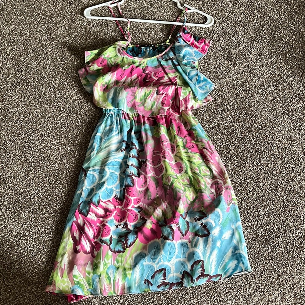 Women’s dress size xs, never worn. Adjustable straps, 100% silk